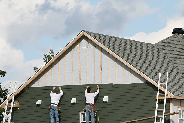 Professional Storm Damage Siding Repair technician working in Marion, PA